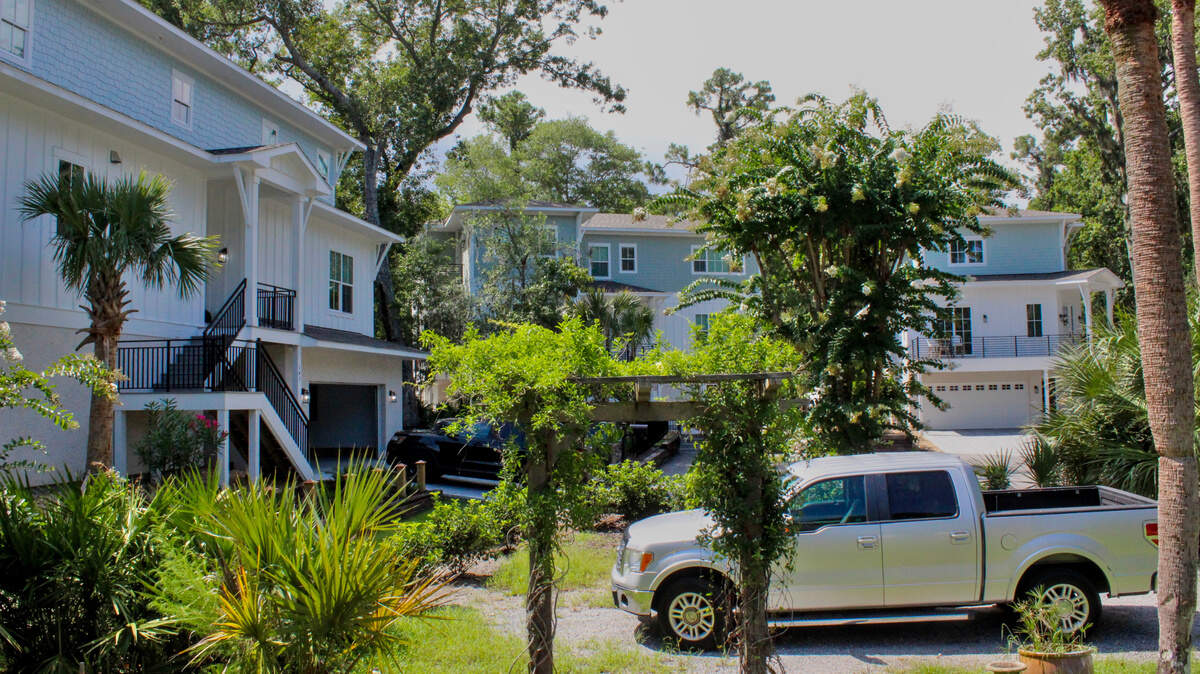 Three-story vacation homes encircle a small cul-de-sac near  on Shell Midden Lane. 