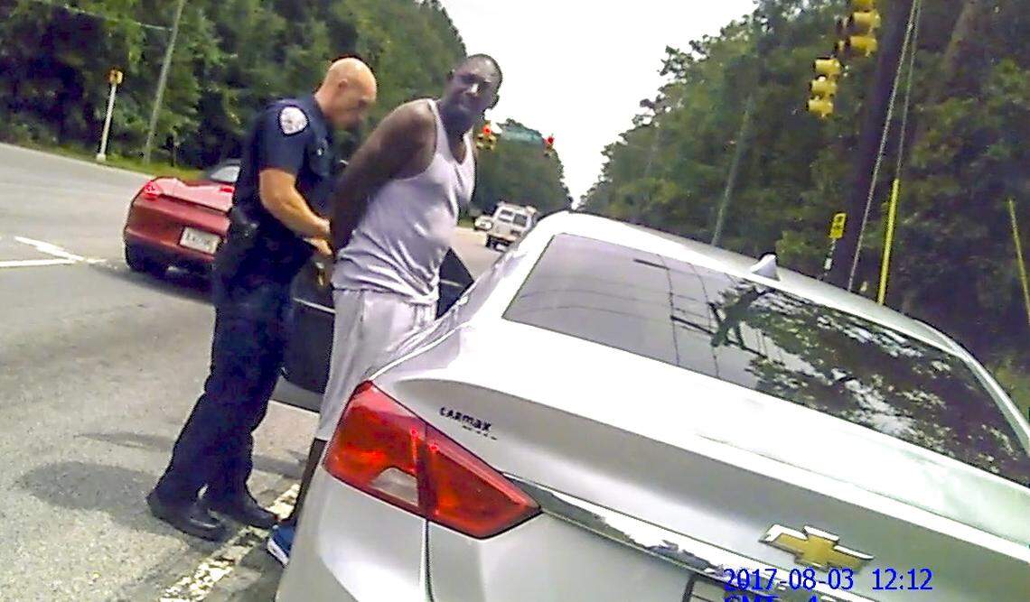 The bodycam of Bluffton Police Officer Amber Swinehamer shows fellow officer Cody Kirkman putting handcuffs on Bluffton resident Teddy Ellis on Aug. 3, 2017, after an Automatic License Plate Reader alerted Kirkman that Ellis’ vehicle registration was suspended.