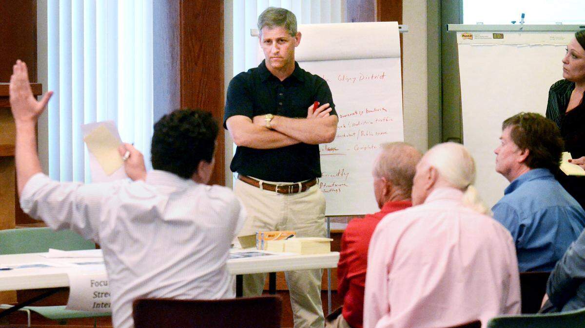 Town of Hilton Head Island Planning Commission member David Bennett, standing, leads a discussion group during an April 2, 2014, meeting in which the public was invited to make suggestions on how to improve the island's Coligny area.