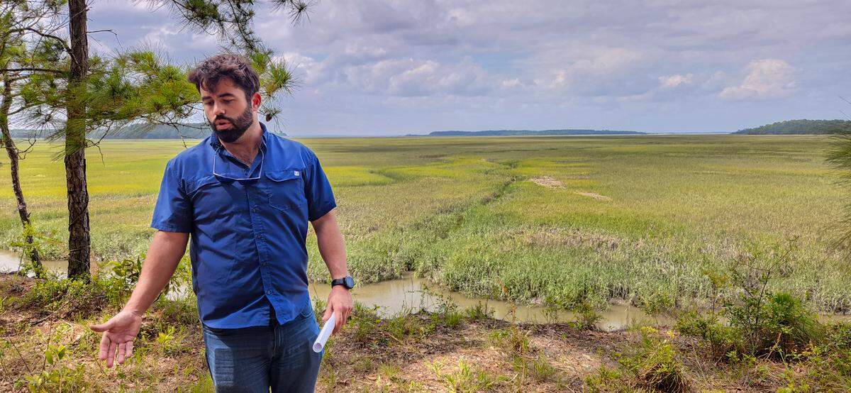 Elvio Tropeano stands on the mainland bluff of his Pine Island Plantation property overlooking the marshes of Edding Creek on May 23, 2023 on St. Helena Island. 
