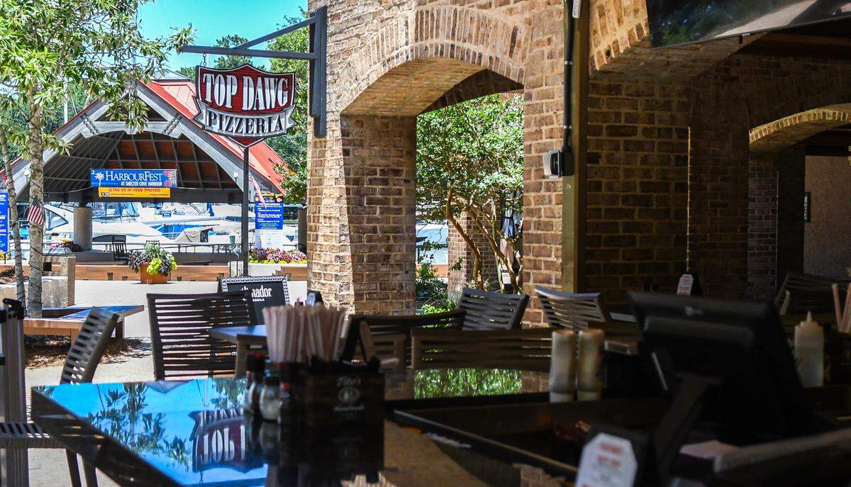 An expansion of Top Dawg Tavern now includes a pizzeria, each having an outdoor patio, located in Shelter Cove Harbour and Marina on Hilton Head Island.