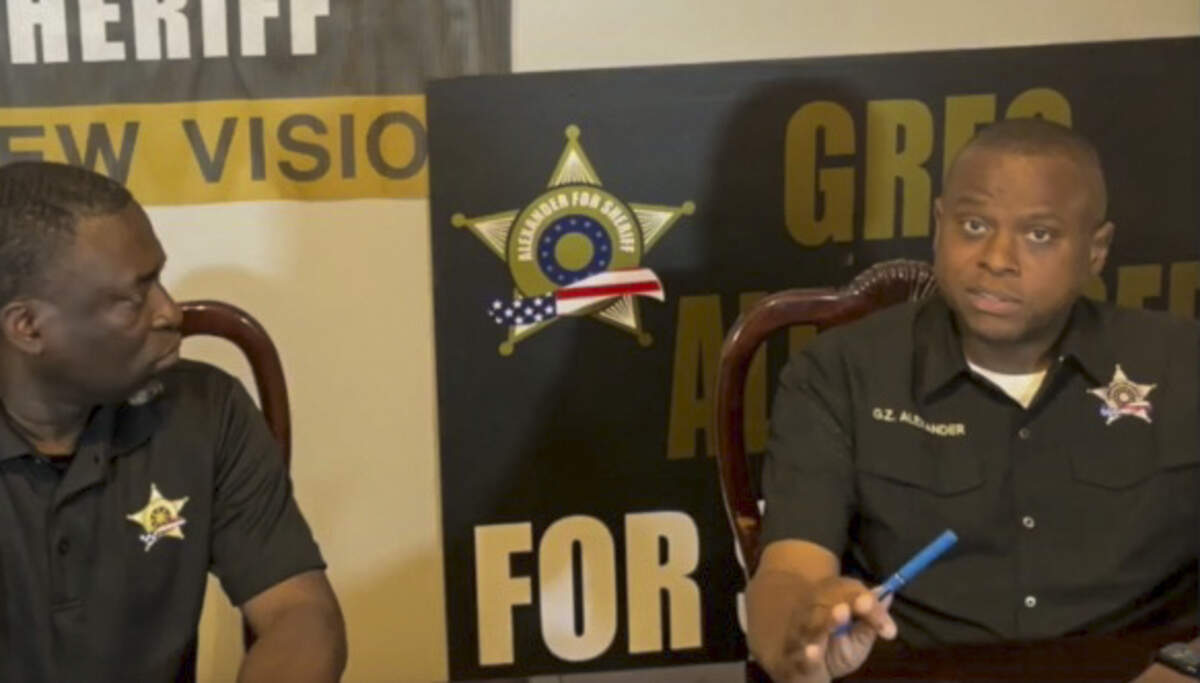 A screen grab of Gregory Alexander, right, as he speaks to the camera during a question and answer session on March 21 that was livestreamed on Facebook.