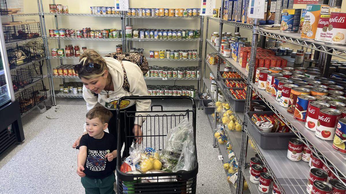 Annalee Hitchcock and her son Cylas shop at the HELP of Beaufort food pantry Monday morning. “It’s definitely helpful,” says Hitchcock.