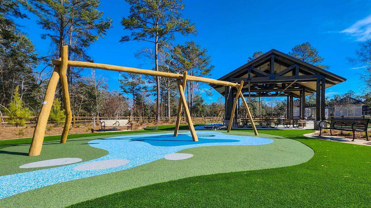 A combination swing with traditional seats as well as a ‘bird nest’ seat, right, as well as a covered area with tables, background, as photographed on Jan. 28, 2025, is featured in one section at the New Riverside Barn Park set for a grand opening on Feb. 22 in Bluffton.