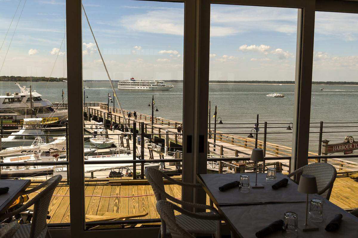 Expansive windows look on onto the Harbour Town Yacht Basin and Calibogue Sound from the new Quarterdeck restaurant’s second floor in Sea Pines on Hilton Head Island.