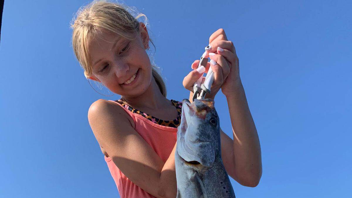 Olivia Gibson Loveless, age 10, with huge trout she caught fishing with me last week. She’s hooked!