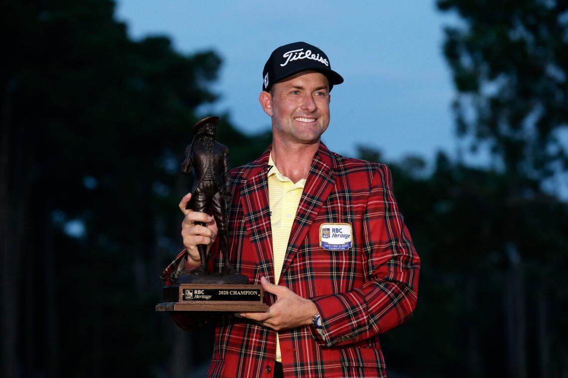 Webb Simpson holds the championship trophy after winning the RBC Heritage golf tournament, Sunday, June 21, 2020, in Hilton Head Island, S.C. (AP Photo/Gerry Broome)