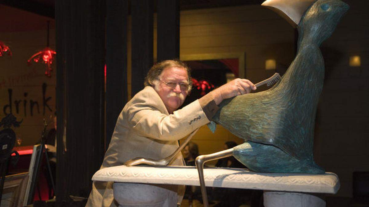 Walter Palmer brushes up one of his bird sculptures when the Island School Council for the Arts staged a "Palmer Family Tribute" during the 2010 Evening of the Arts fundraising auction.
