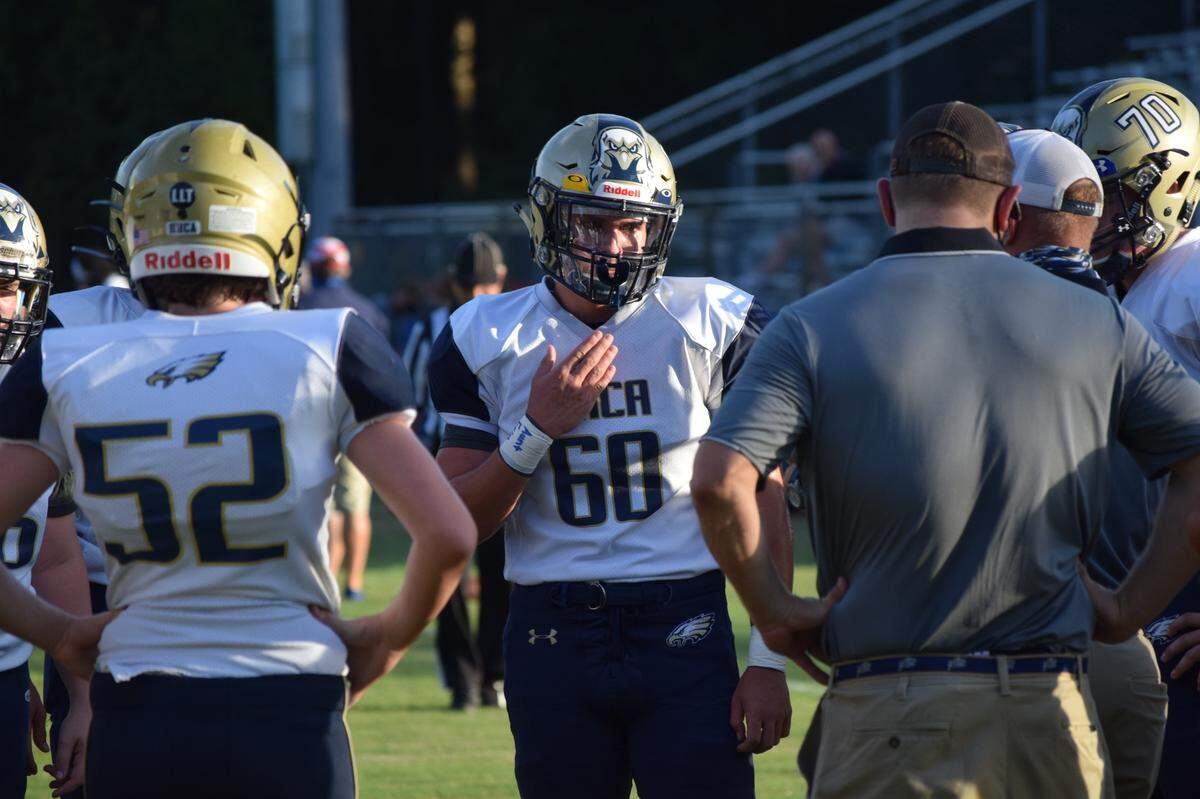Football players for Hilton Head Christian Academy had additional plastic put on their helmets as a COVID-19 precaution during a game on Friday, Aug. 28, 2020 on Hilton Head Island.