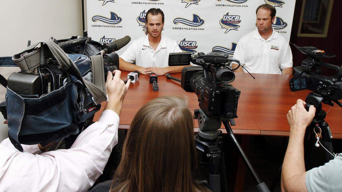 USC Beaufort baseball pitcher Jason Boulais, left,  and baseball coach Bryan Lewallyn, right, sit during a press conference at Sand Shark Recreation Center, USCB Hilton Head Gateway campus, on March 30, 2015.  Jason Boulais, is scheduled to donate bone marrow for a young boy next month. The senior found out in mid-February he was a match and needed to give a blood sample for further testing. After doing so, Boulais learned he wasn?t just a match ? he was the boy?s best match, his best chance at survival. Along with that news came the realization that going through with the process would mean Boulais would miss several games during conference play, and depending on his recovery time, he might not be able to pitch again before the end of the season ? and his career. To watch a video, go to:?http://bit.ly/1gf1c6W