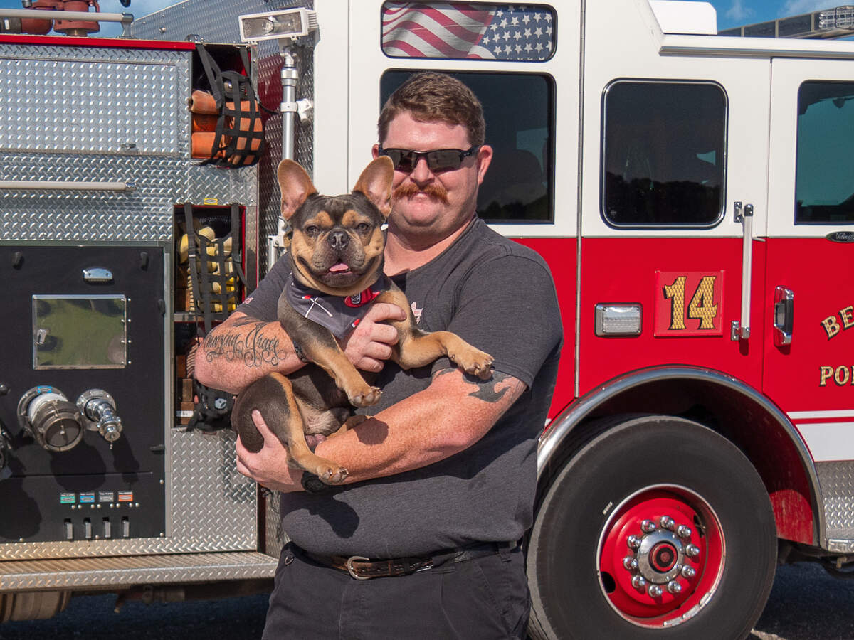Firefighter Wes Carter and Thor, a French bulldog, were models in a 2025 calendar featuring 20 photographs of firefighters and therapy dogs. The therapy dogs began making regular visits to local fire stations last year. “When I saw the rapport between firefighters and dogs, I said, ‘You know what, we should do we should do a calendar featuring therapy dogs and firefighters,” said Rebeccas W. Bass, who produced it.