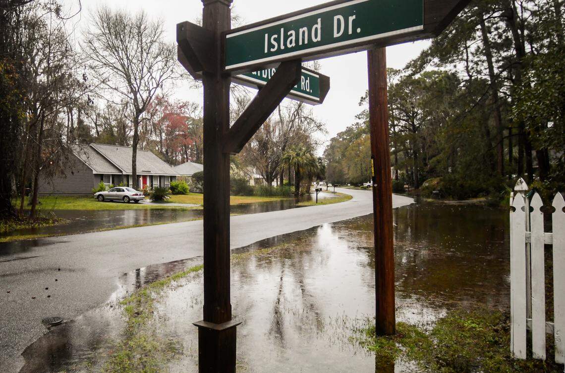 Water fills the culverts and the front yards of homes along Marblehead Road in Old Woods Plantation on Thursday, March 5, 2020 after more than a day of heavy rains on Hilton Head Island. A resident driving out of the neighborhood stopped and proclaimed, ”We now have waterfront property.” The National Weather Service reported a low pressure storm system stalled over the Southeast and southern mid-Atlantic states that spawned a deadly tornado in Nashville and produced locally heavy rains and dangerous lightning.