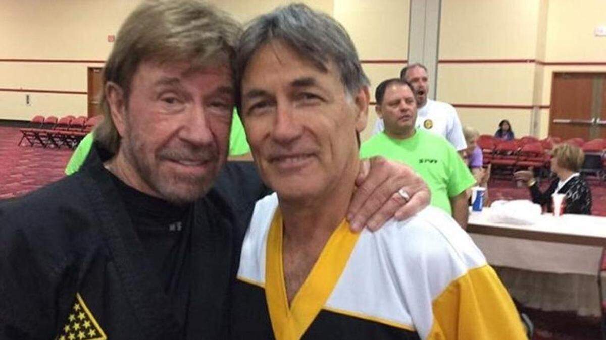 Chuck Elias of Beaufort poses for a picture with Chuck Norris around 2018.