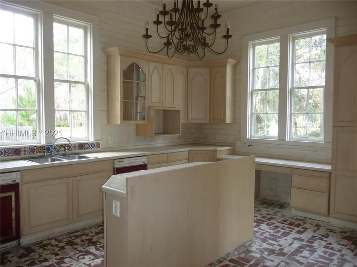 The kitchen and laundry areas at the Rose Hill Mansion have brick floors.