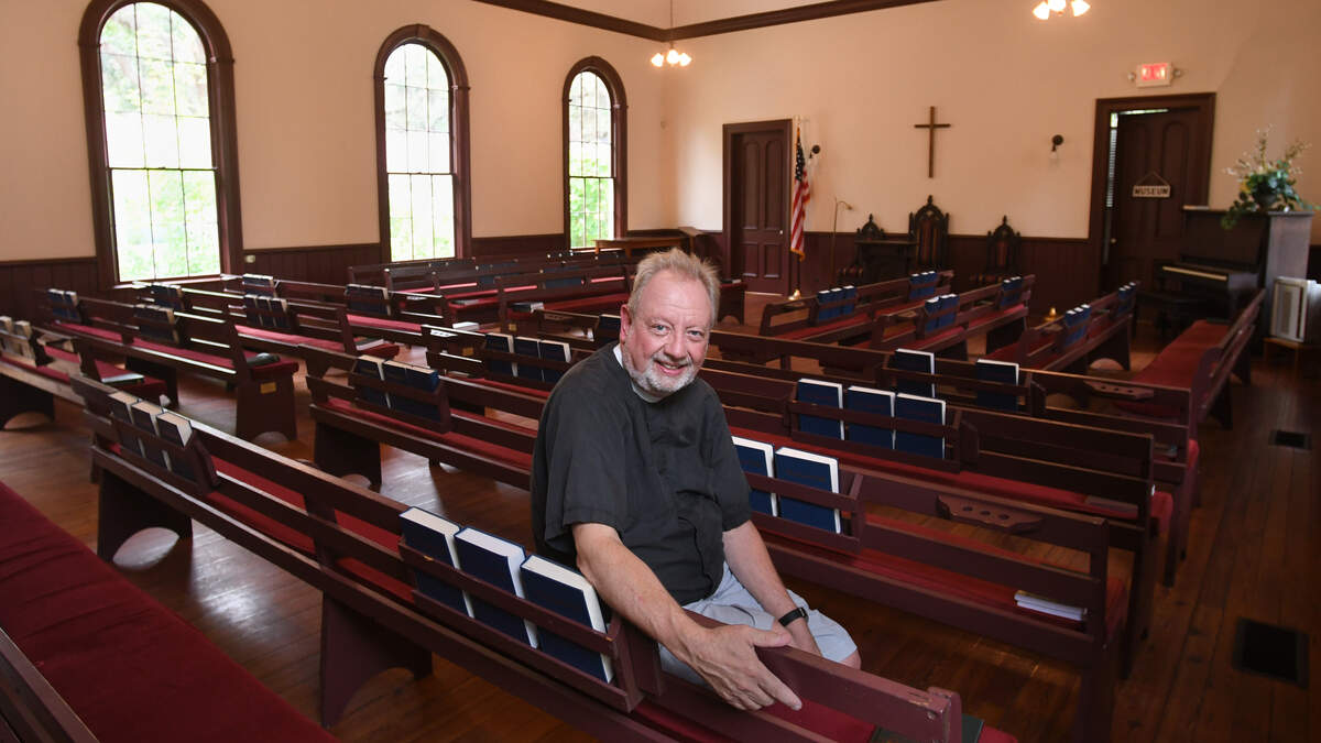 The Rev. Roy Tripp, priest of St. Mark's Episcopal Church in Port Royal, is photographed in Port Royal's historic Union Church on Thursday. His congregation has long worshipped in the church on 11th Street, and recently purchased the building to become its permanent home.