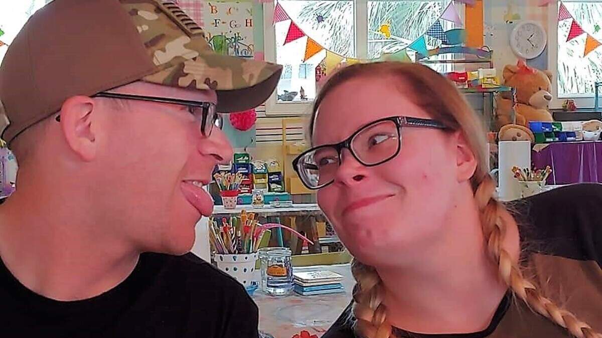 U.S. Army Sgt. Christopher Bass clowning with Mettea Green at the Art Cafe on Hilton Head Island as two couples were hosted by Operation R&R following deployments to Korea.