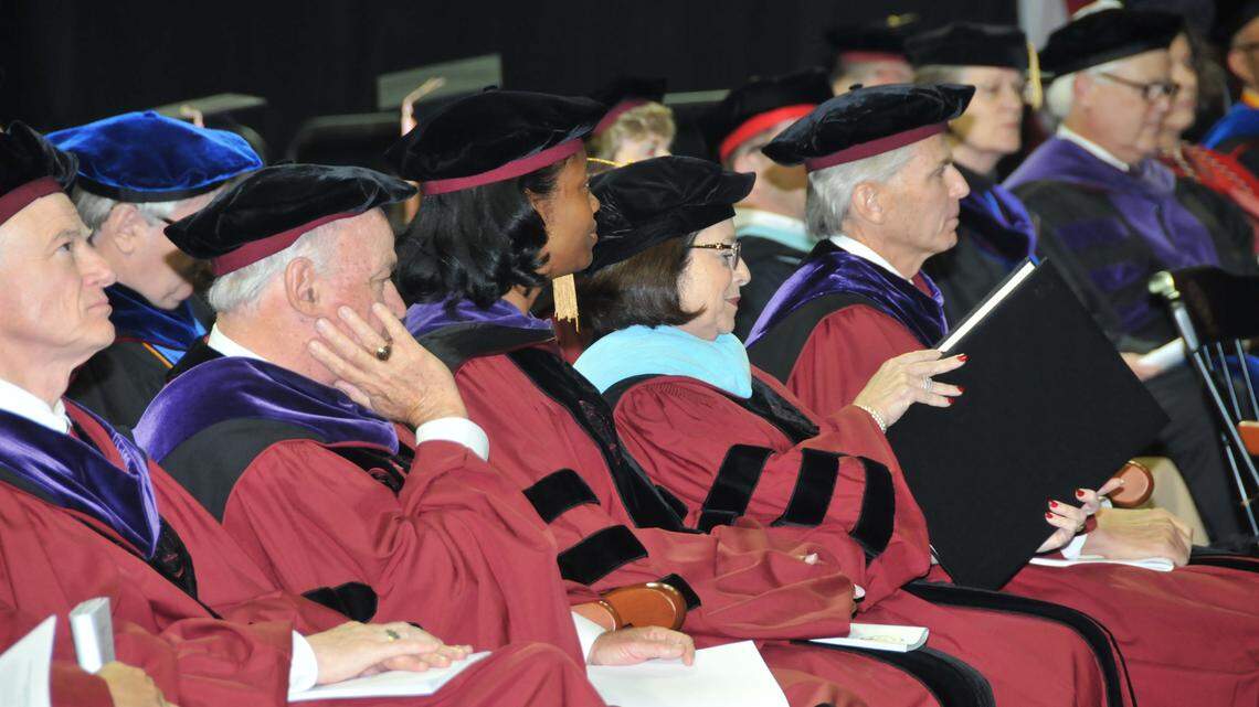 Philanthropist and advocate for education Anita G. Zucker, center, receives an honorary doctorate of education during USC Commencement Exercises on Saturday afternoon, May 10, 2014.