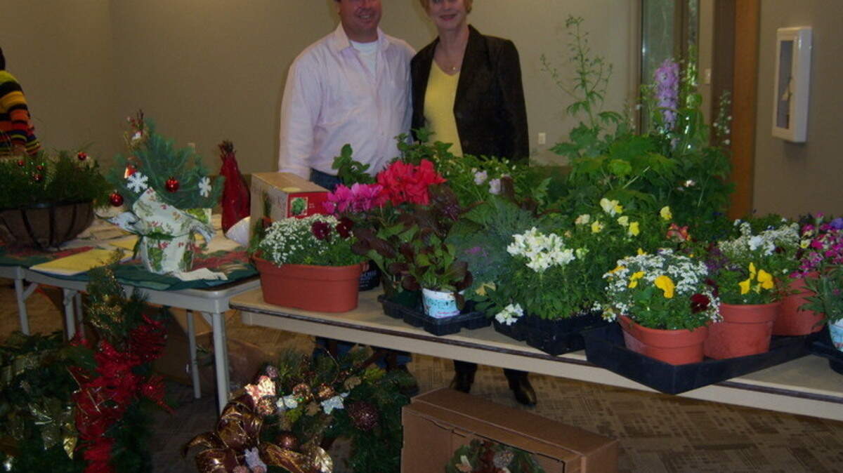 William Thompson and his mother display a variety of Christmas plants, wreaths and decorations. Thompson, of Buds and Blooms Nurseries, was the featured speaker at the Hilton Head Island Avid Gardeners' November meeting. 