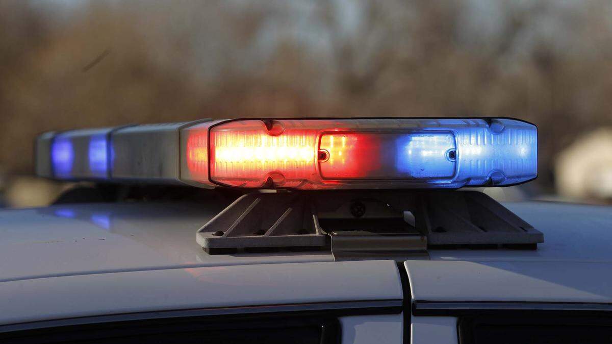 A police car turns on its lights.