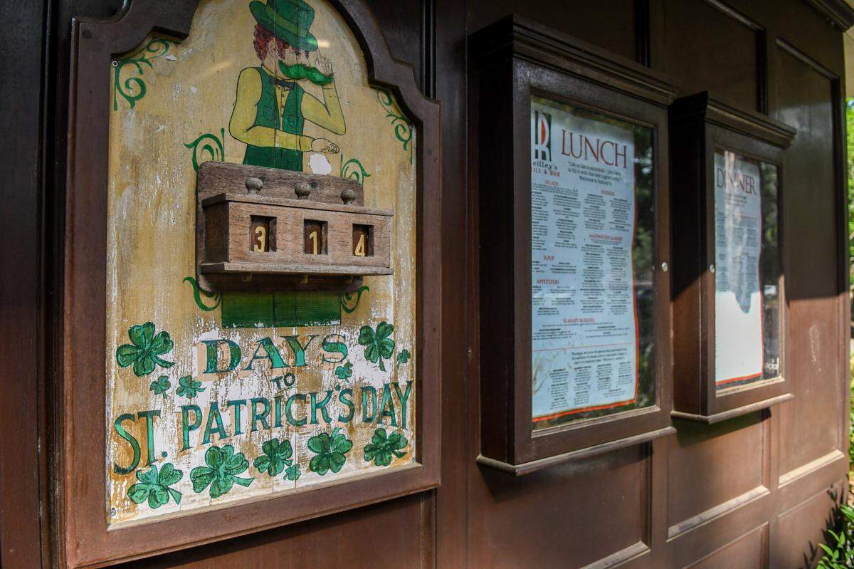 A countdown calendar for the next St. Patrick’s Day is prominently displayed with the menus outside the door to Reilley’s Grill & Bar on May 8, 2025, on Hilton Head Island.
