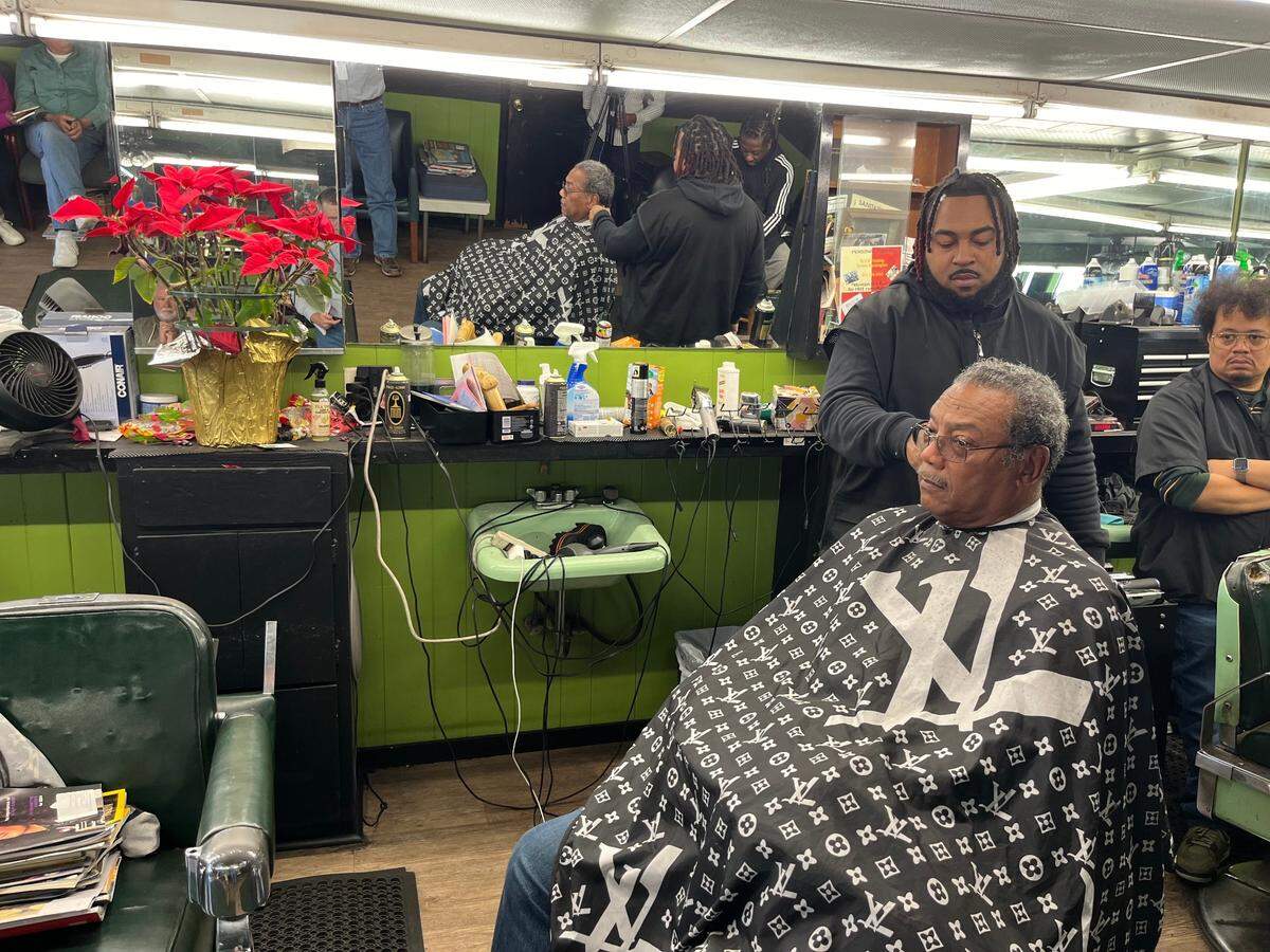 Kenneth Singleton Jr. cuts the hair of Chuck Jones at Singleton’s Barber Shop Tuesday. Mitch Landrieu, the national co-chair of the Joe Biden-Kamala campaign, and Christale Spain, chairwoman of the South Carolina Democratic Party, led a get-out-the-vote rally at the barber shop Tuesday afternoon.