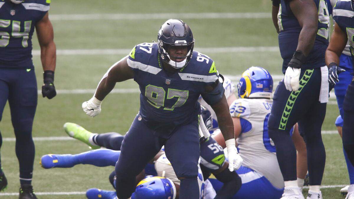 Seattle Seahawks defensive tackle Poona Ford in action against the Los Angeles Rams during the first half of an NFL wild-card playoff football game, Saturday, Jan. 9, 2021, in Seattle.