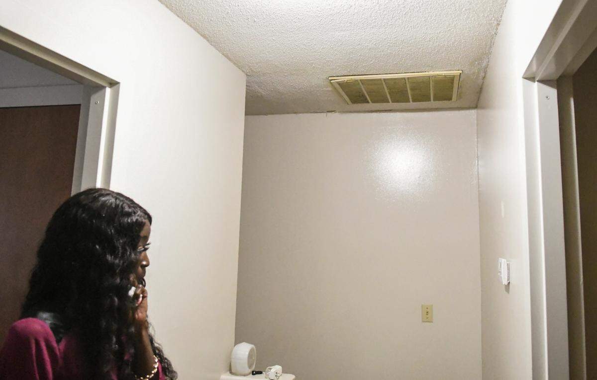 Evident in every room but more visible because of a ceiling fixture, Tiffany Glover, a single mother and resident of Sandalwood Terrace apartments shows on Wednesday, Oct. 21, 2020 peeling paint and poor patching at the HVAC return in the upstairs hallway. Glover and her son have been prescribed inhalers that she has attributed to the excessive amounts of moisture causing mold in the Hilton Head Island complex.