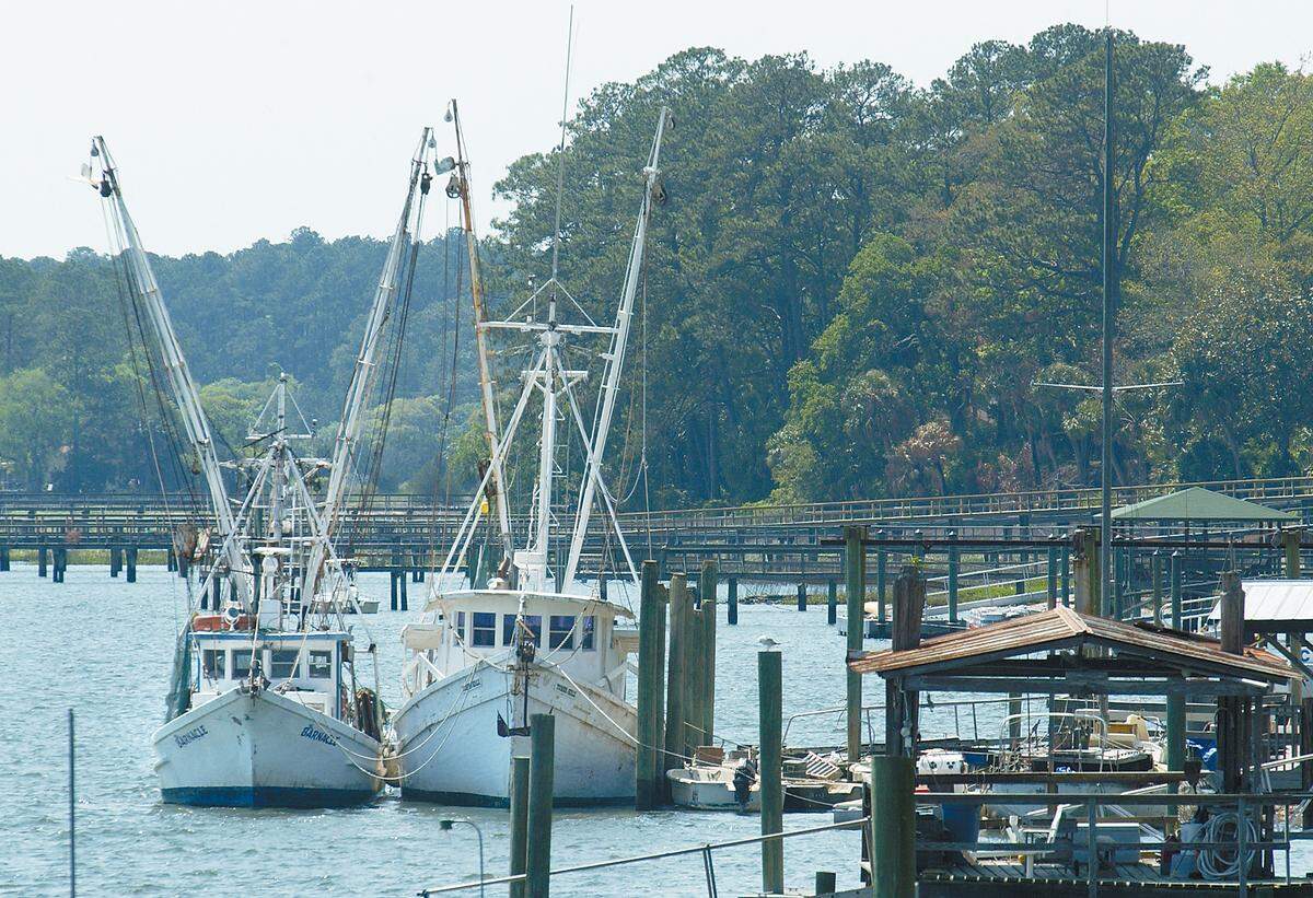 In this file photo from 2015, the shrimp boats The Barnacle, left, and Toomer Girls float at the Bluffton Oyster Company dock on the May River in Bluffton.