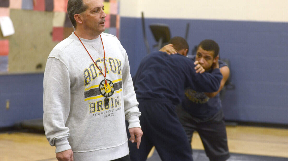 In a 2015 file photo, Battery Creek High wrestling coach Nathan Day gives instructions to the wrestlers during practice.
