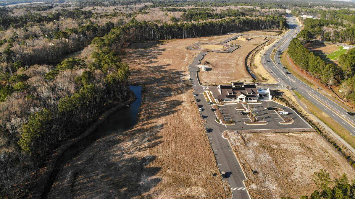 Home builder Logan Homes wants to add townhomes to the Washington Square development along Buckwalter Parkway, as seen on Friday, Feb. 25, 2022, in Bluffton. The remaining property, which includes Lowcountry Fresh Market & Café, will feature retail, residential and office spaces with apartments on the top floors.