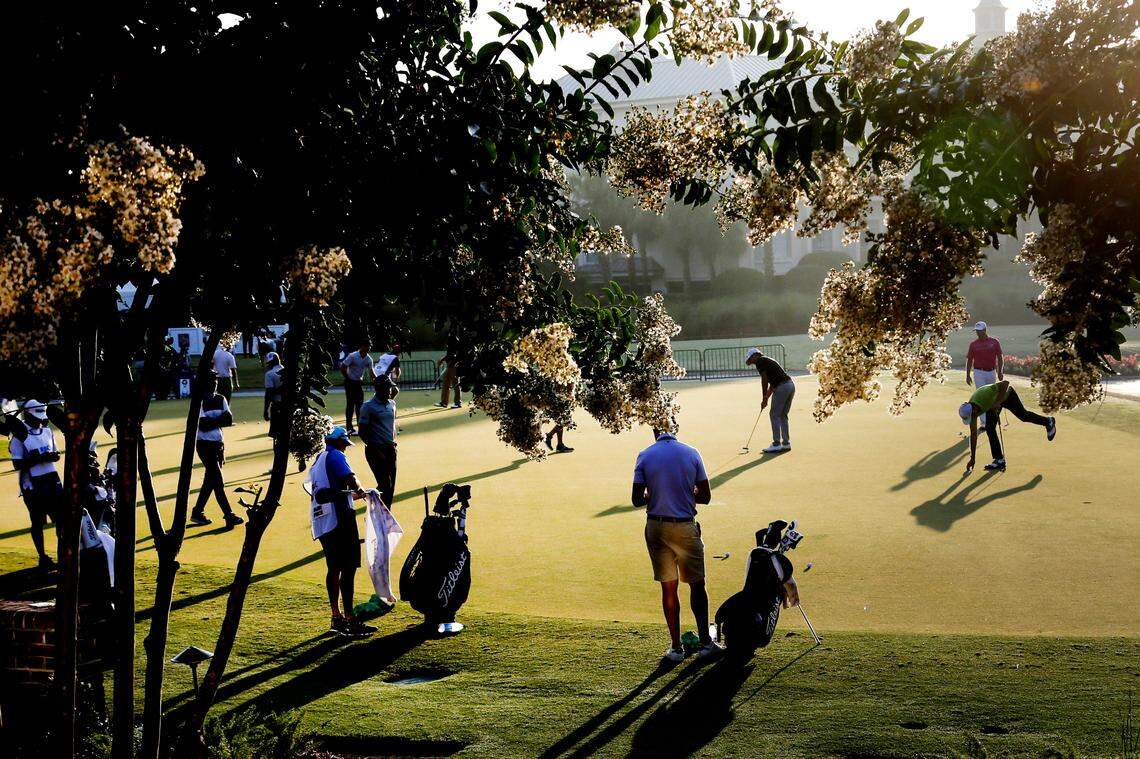 Golfers warms up on the practice green, during the second round of the RBC Heritage golf tournament, Friday, June 19, 2020, in Hilton Head Island, S.C. (AP Photo/Gerry Broome)