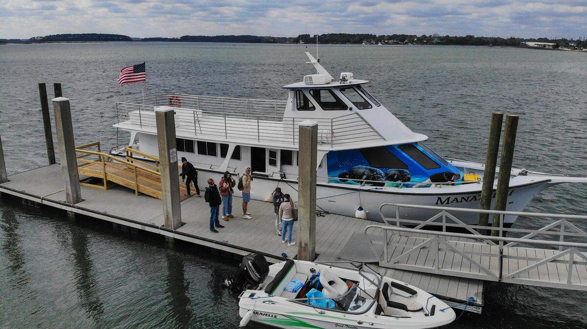 Daufuskie Island, S.C. residents wait for their belongings after disembarking from the Manatee II, the new larger ferry contracted by Beaufort County to move people and their belongings to and from the island to the mainland as photographed on Jan. 31, 2024 at C.C. Haigh, Jr. Boat Landing on Jenkins Island.