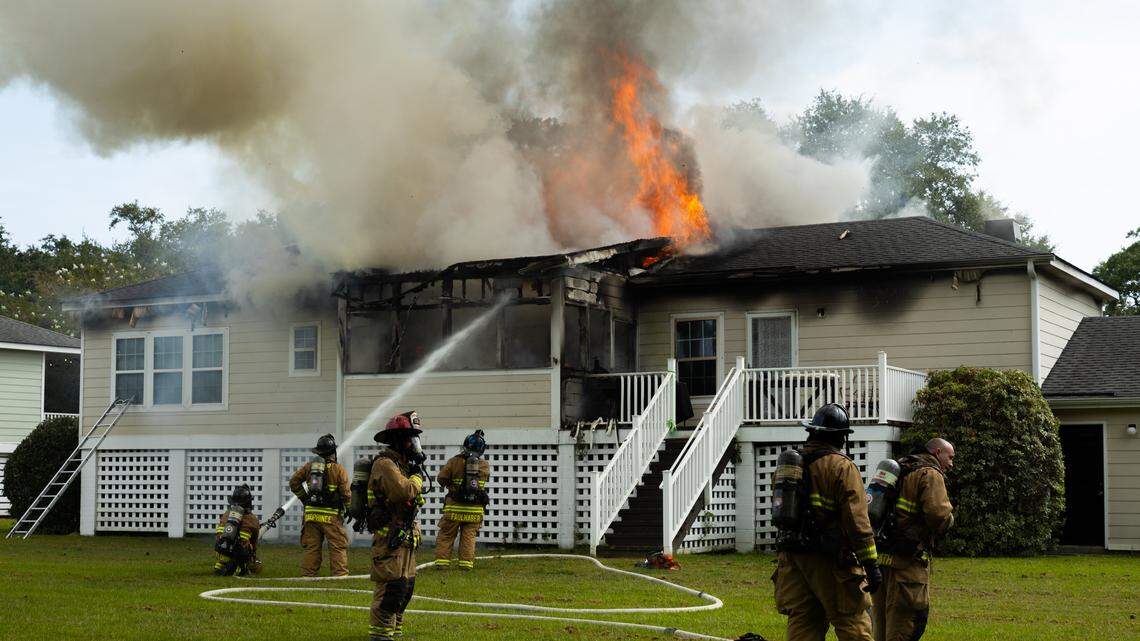 Firefighters battle a blaze in the officer housing area at Marine Corps Recruit Depot Parris Island in Port Royal Wednesday afternoon.