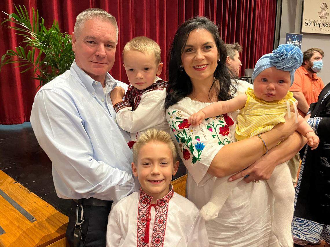 Inna Lanigan, right, of Beaufort, who is from Ukraine, says she talks with her mother back home each day. “It’s so difficult,” she of the Russia-Ukraine war. Also pictured: Husband David holding Johnny, 4; 7-year-old Thomas; and Matrona, 6 months.