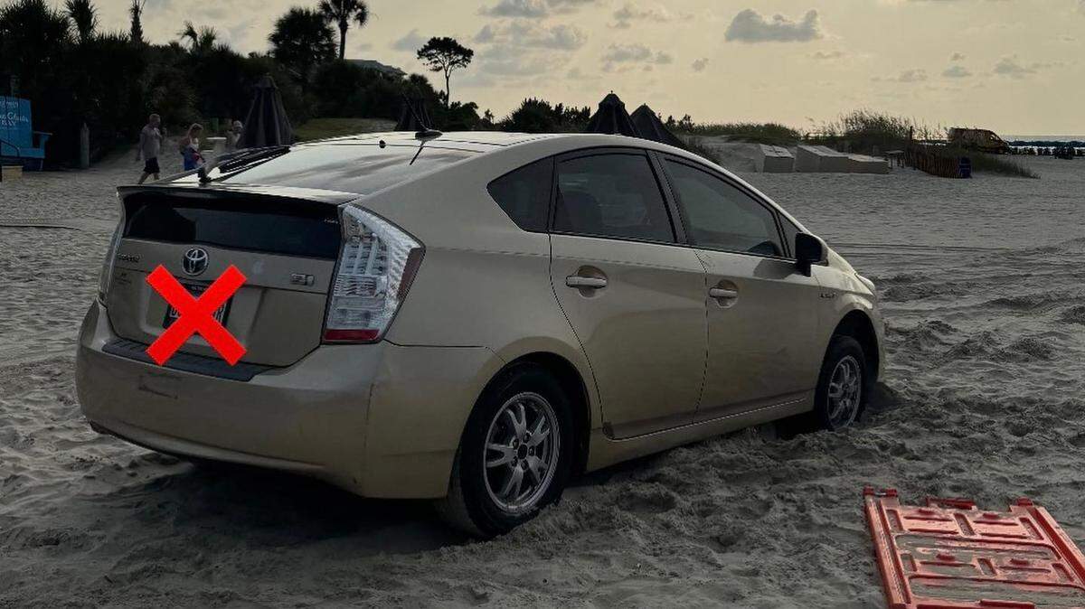 A Toyota Prius was stuck in the sand on Coligny Beach, in front of the Tiki Hut, Sunday morning.