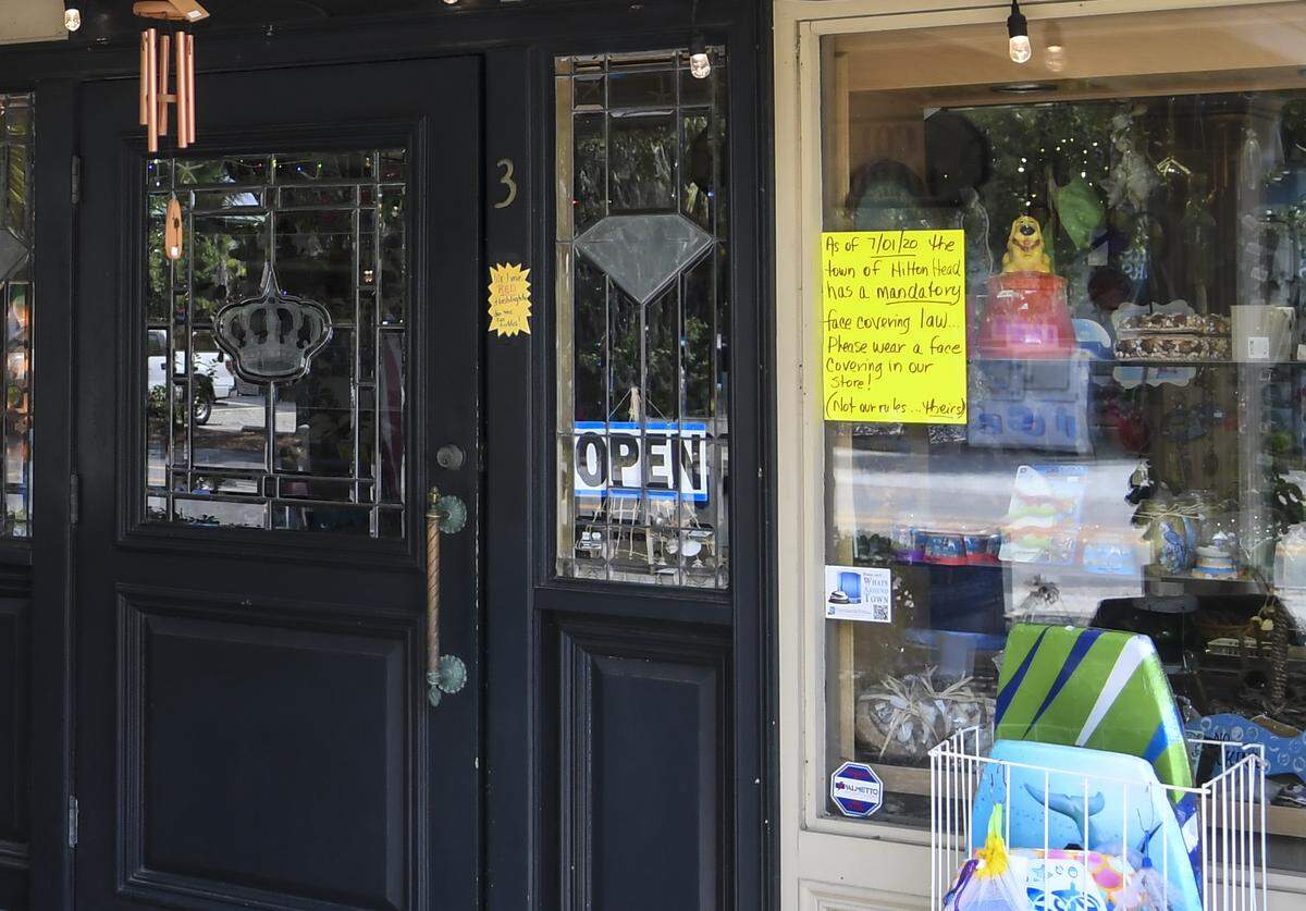A sign at the entrance to Hilton Head Island’s Coligny Hardware on Wednesday, July 1, 2020 informs customers they must wear a mask when entering the store.