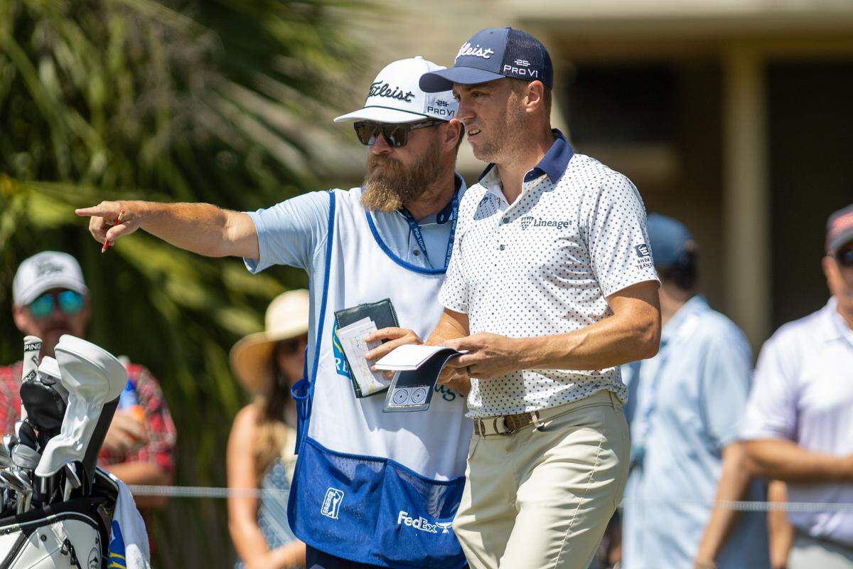 Justin Thomas, right, takes advice from his caddie, Joe Griner, at the seventh during the second round of the RBC Heritage Presented by Boeing at Harbour Town Golf Links on Friday, April 18, 2025, in Sea Pines on Hilton Head Island.