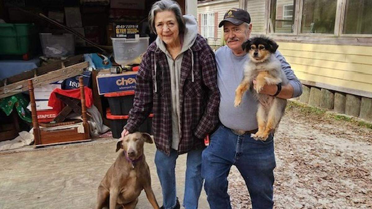 Karen and Dwane Wilkins leaving Maranatha Farm Animal Rescue with their earthly goods and two of their dogs, Athena and Sassy.