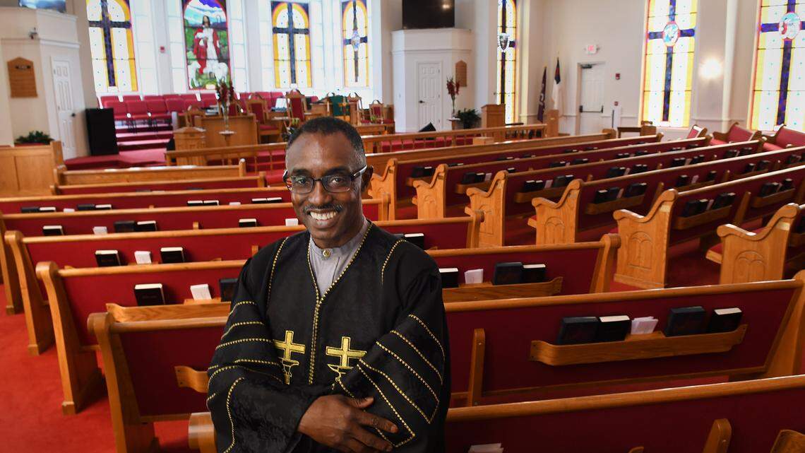 The Rev. Jon. R. Black, pastor of Bluffton's Campbell Chapel AME Church, is photographed on Thursday in the church sanctuary after it was announced that an anonymous benefactor wired more than half a million dollars — $511,386.99 — to the bank last week, paying off the church's mortgage and leaving the congregation of about 270 members debt-free.