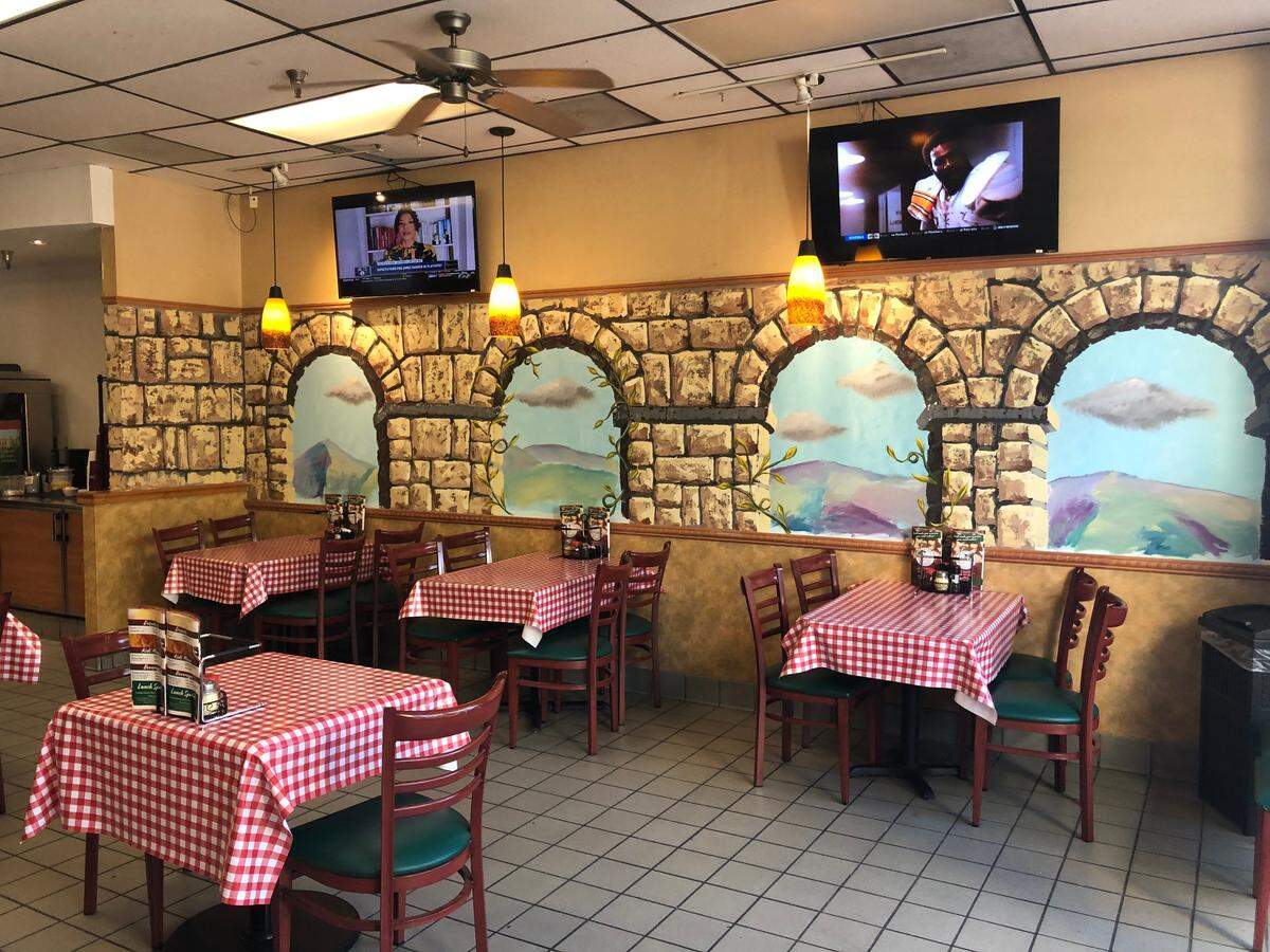 Murals have been painted on the walls in La Pizzeria.