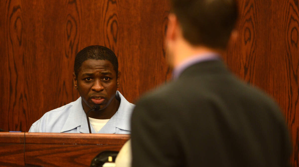 Tyrone Robinson, left, answers questions from his attorney, Arie Bax, while on the stand in his trial on Sept. 18, 2014, at the Beaufort County Courthouse.
