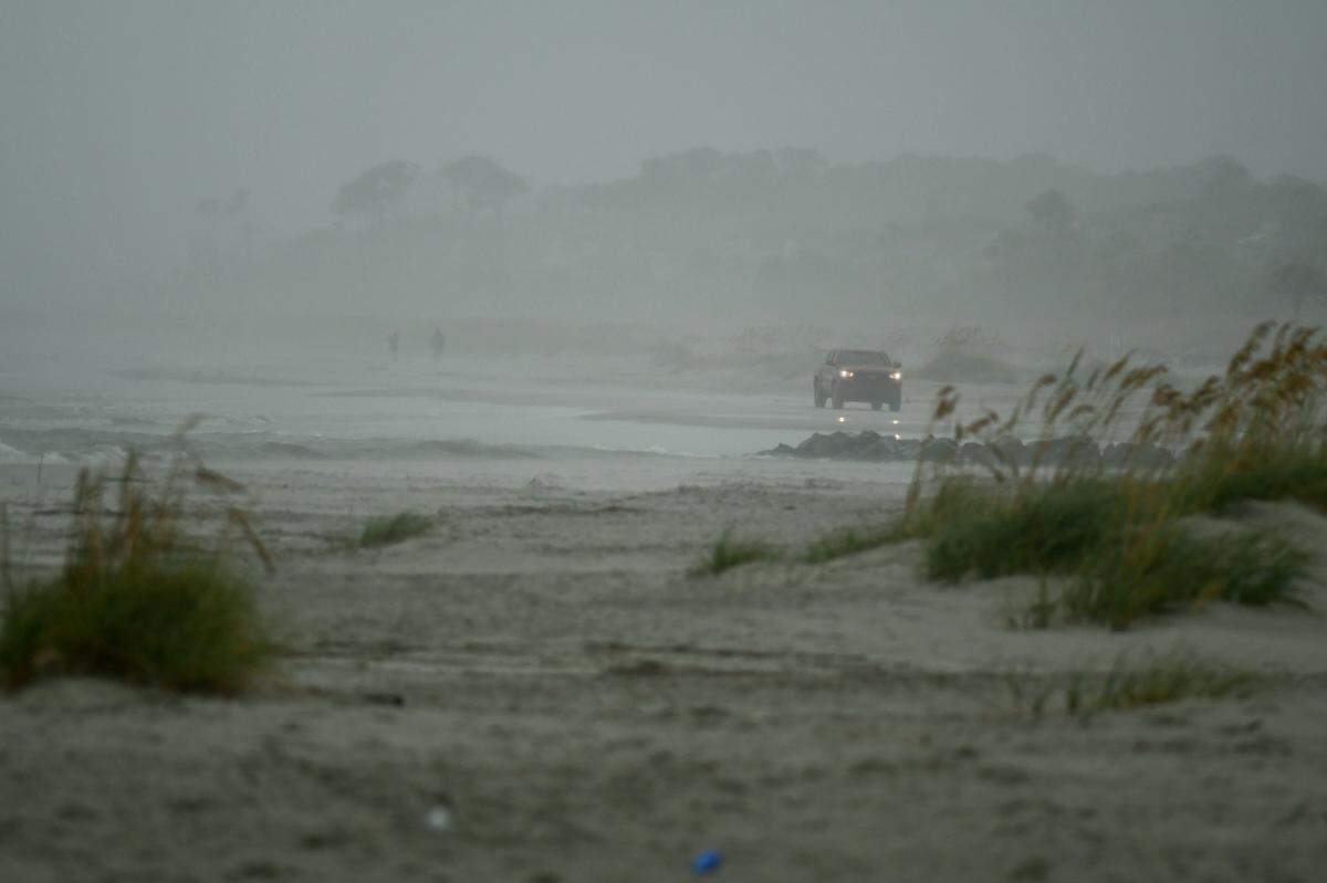 As Tropical Storm Isaias churns in the Atlantic Ocean, a Shore Beach Services vehicle slowly makes it ways toward an empty Burkes Beach on Monday, August 3, 2020 on Hilton Head Island.