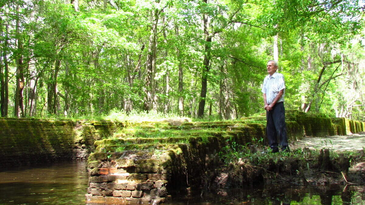 Voice of the past: Local resident Jerry Williamson pauses beside the old brick lock of the Savannahâ€"Ogeechee Barge Canal to share memories and tales of the canal in its heyday.
