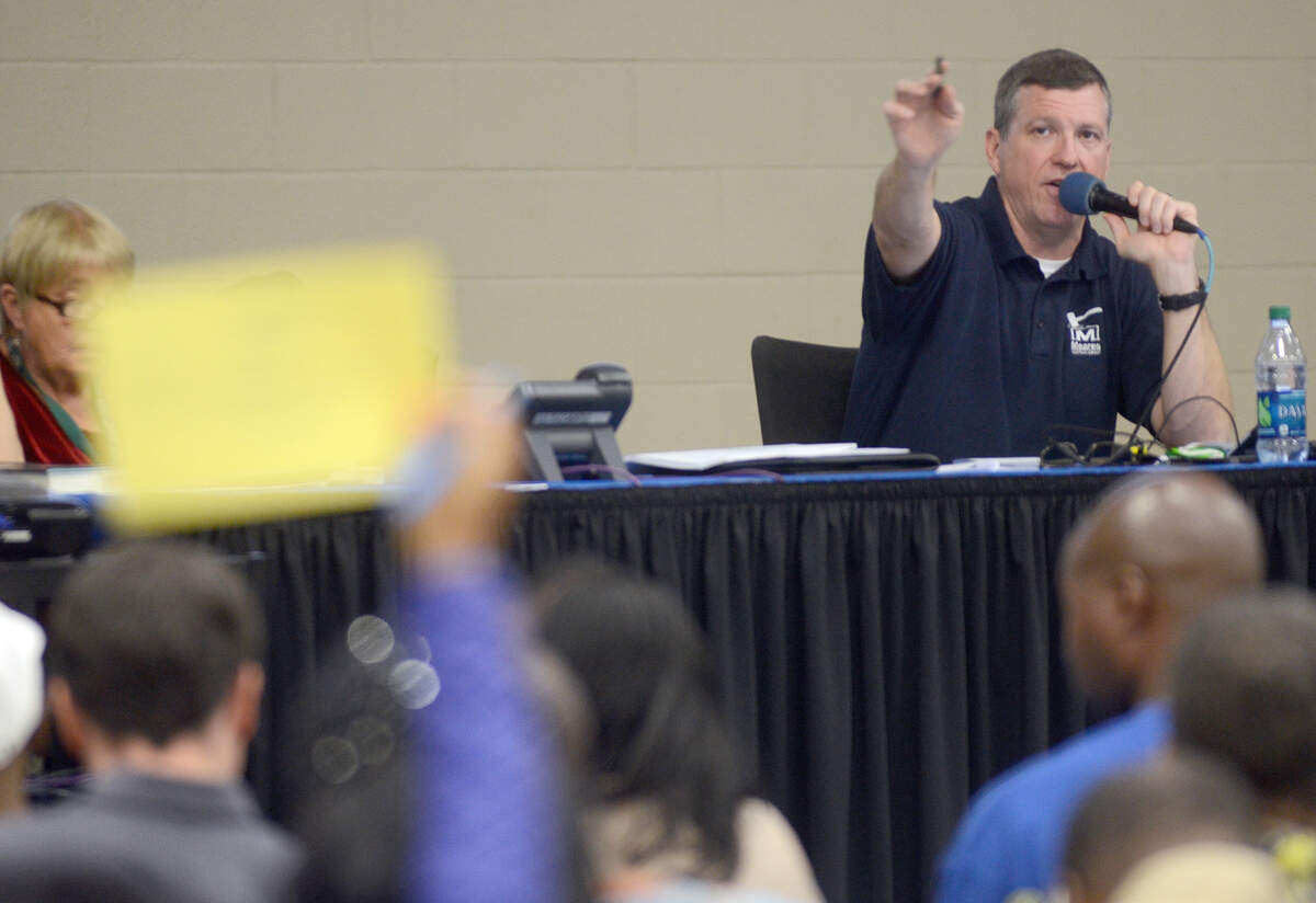 Darron Meares with Meares Auctions acknowledges a bid during the Beaufort County Delinquent Tax Auction the morning of Oct. 6, 2014, at Charles Lind Brown Activity Center in Beaufort.
