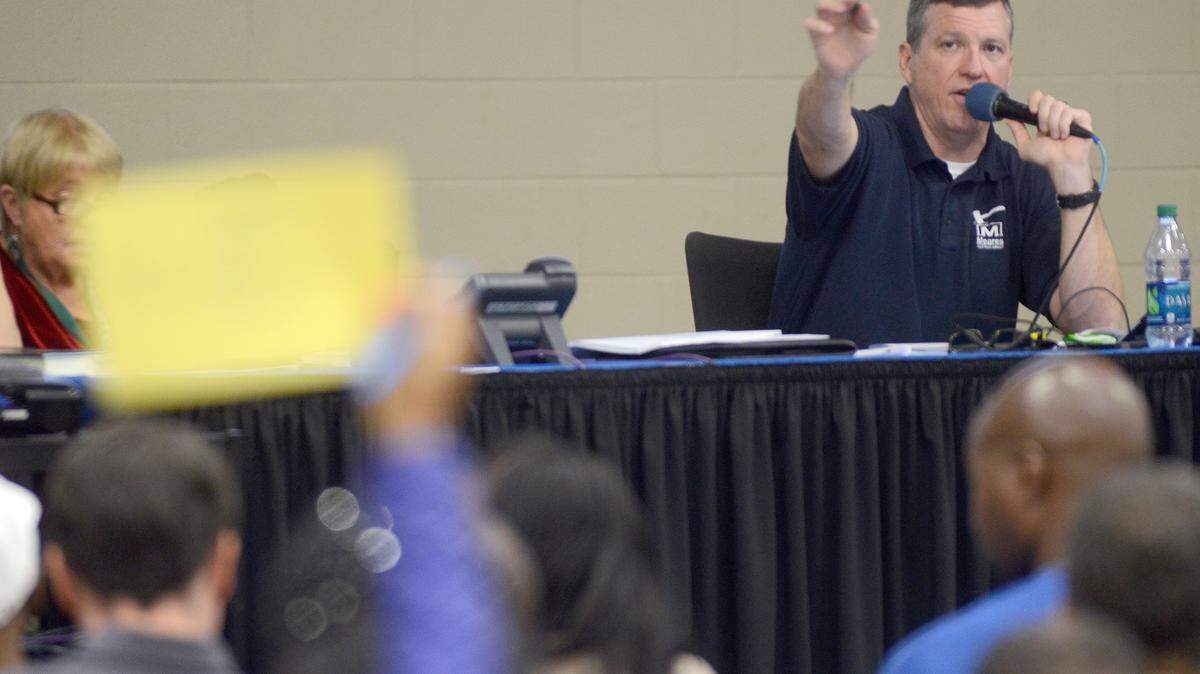 Darron Meares with Meares Auctions acknowledges a bid during the Beaufort County Delinquent Tax Auction the morning of Oct. 6, 2014, at Charles Lind Brown Activity Center in Beaufort.