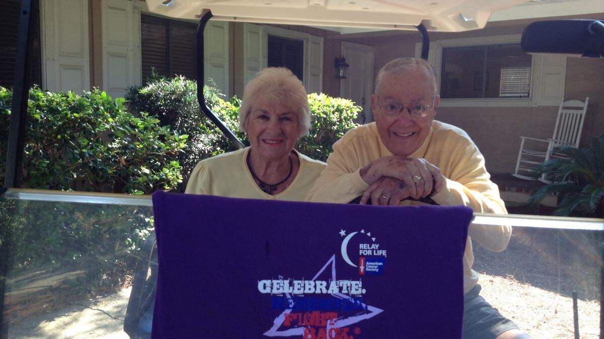 Dr. William and Elena Lackland of Columbia ob a golf cart donated for their use during a special trip to the Hilton Head Island beach in August.