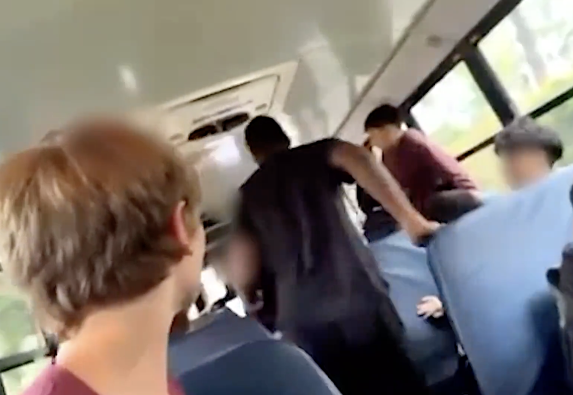 A screenshot of a cellphone video shows a Beaufort County bus driver approaching two students in an altercation the afternoon of May 17, 2024. The mother of a Bluffton Middle School student who was beaten with a Stanley cup during the fight is requesting a settlement from the school district.