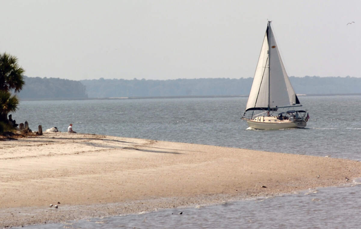 A sailboat glides along the beach at Dolphin Head in Hilton Head Plantation on Friday as part of the annual Hilton Head Plantation Yacht Club's "Sail around Hilton Head." 