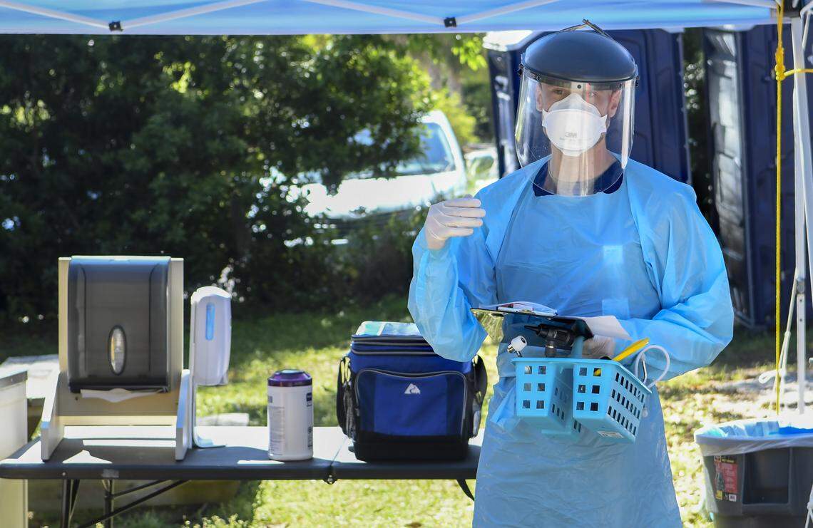 Dr. Mark Bechtel, D.O., wearing full personal protective equipment explains on Friday, April 2, 2020 at Beaufort Memorial Hospital ’s Express Care on Ribaut Road, that Streptococcus or strep and flu tests are done when swabbing patients whose symptoms could be COVID-19. While the coronavirus results must be sent off-site, strep and flu results can be garnered on site within minutes. When asked about positive flu results Bechtel said, “The flu results have been low.”