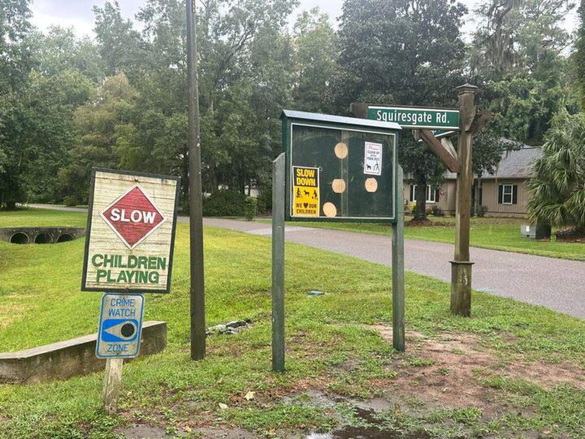 Signs posted outside Hilton Head Island’s Squiresgate neighborhood ask drivers to slow down for children playing. Another sign designates the subdivision as a “crime watch zone.”
